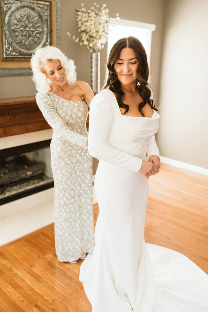 “Bride Michaela getting ready in soft natural light before her elegant St. Louis wedding | editorial candid photo for Arizona luxury wedding inspiration.”