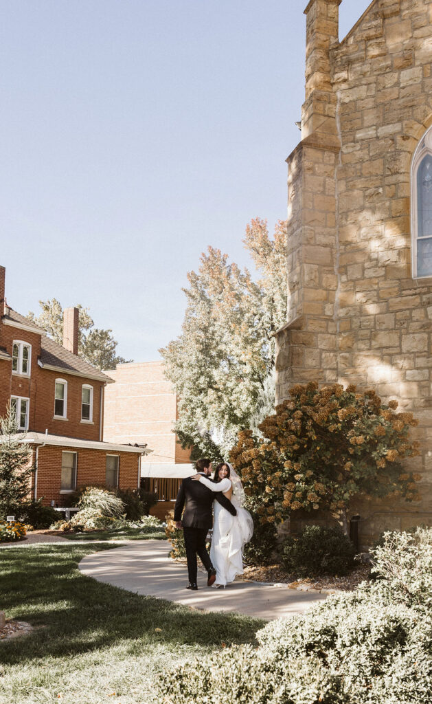“Newlyweds walking hand-in-hand through the golden fall trees at Old Hickory Golf Club | destination wedding inspiration for Arizona brides.”