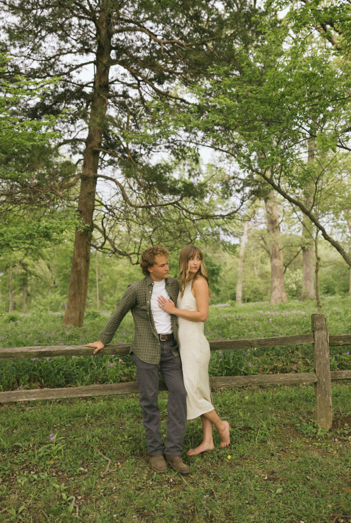 Arizona engagement photographer captures authentic love story in a lush garden with filmy, timeless tones.